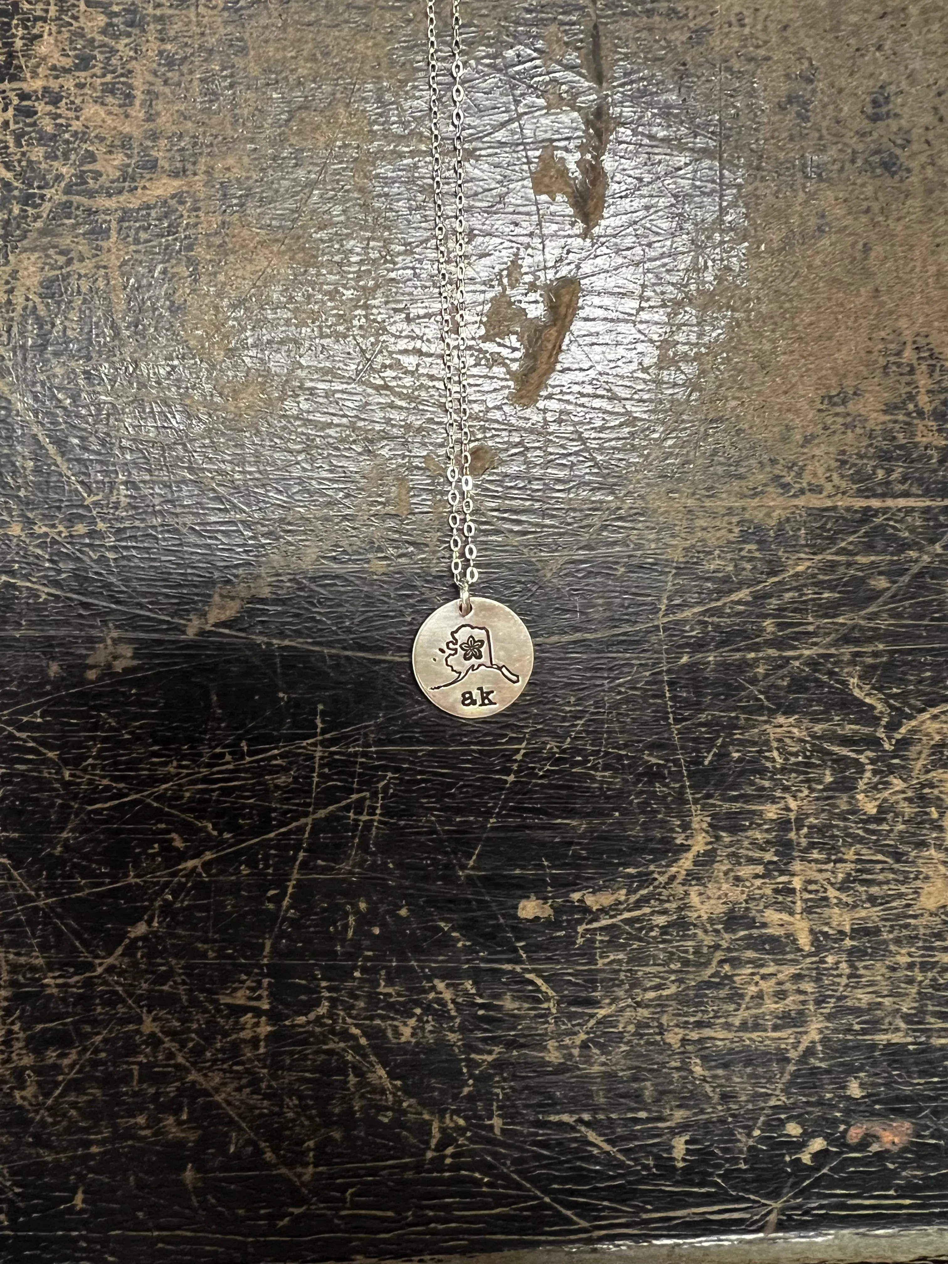 Circle Pendant with Alaska Shape and Forget Me Not AK $49.00