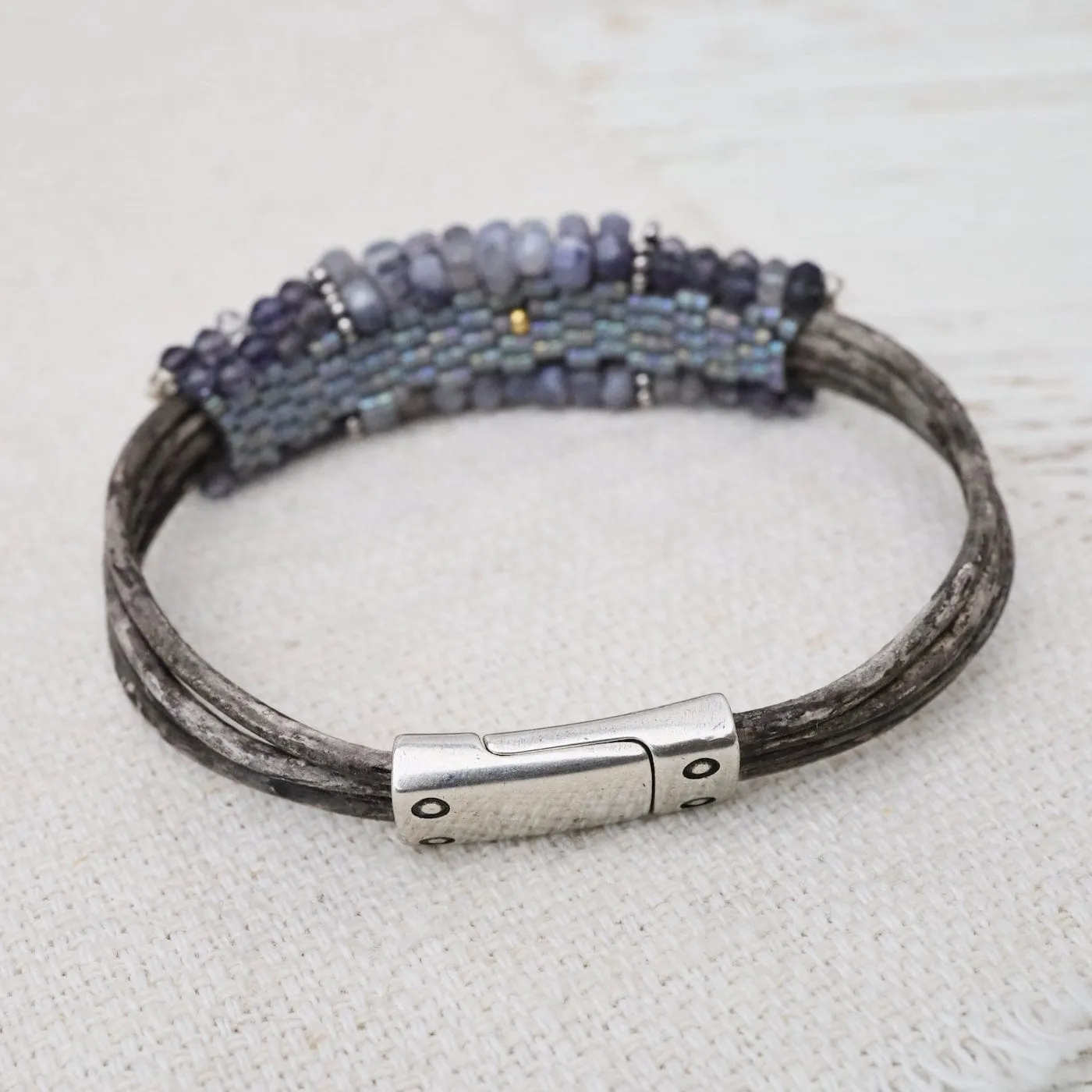 Hand Stitched Banded Iolite with Silver Trim on Multi Strand Leather Bracelet